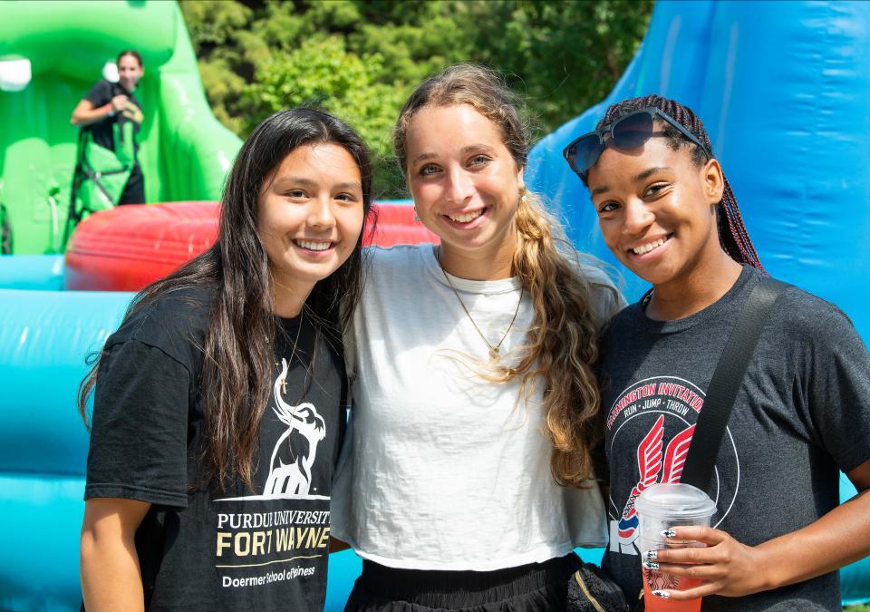 Three smiling students