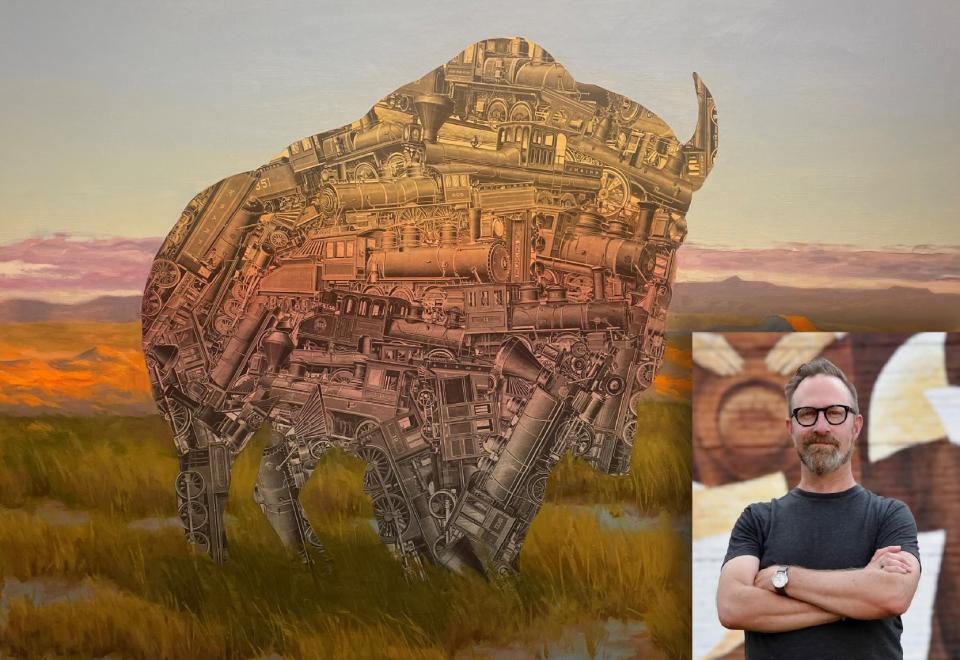man infront of artwork
