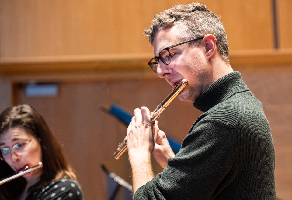 man playing flute