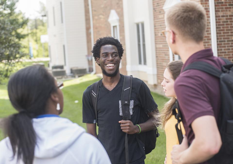 Students talking in a group.