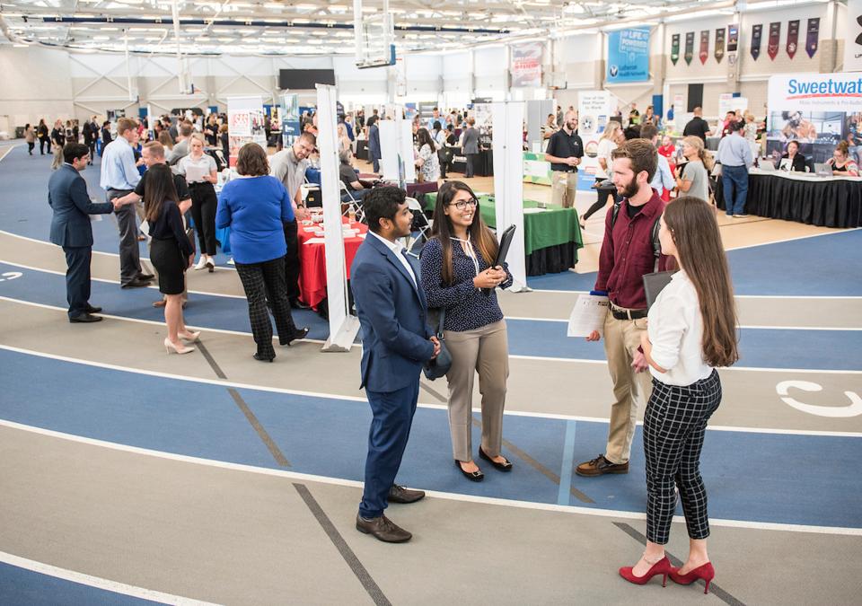 Students collecting information on careers at the career fair.
