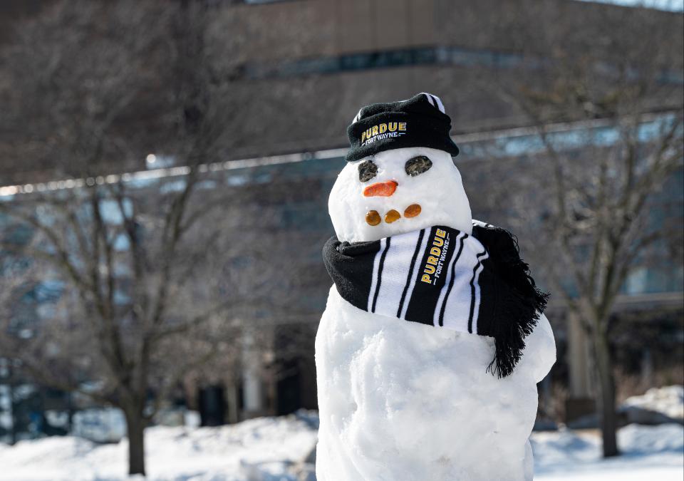 Photo of a snowman dressed in Purdue garb.