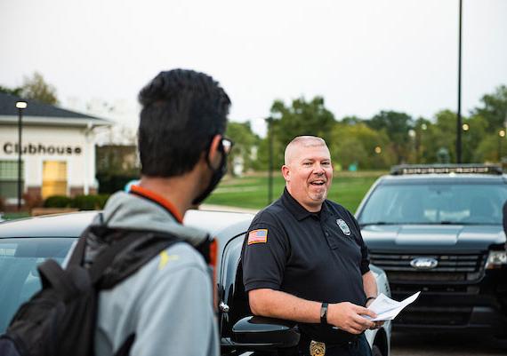 A University Police officer chats with a student