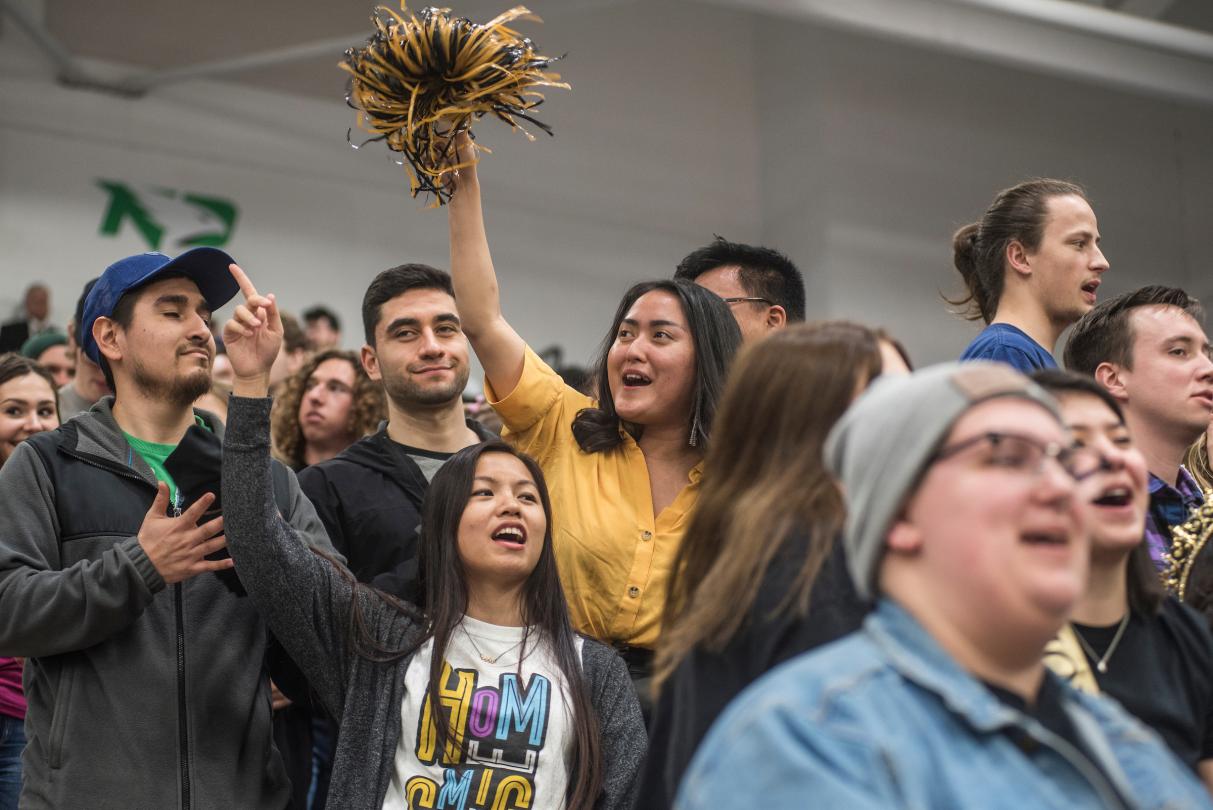 Students cheering at homecoming.