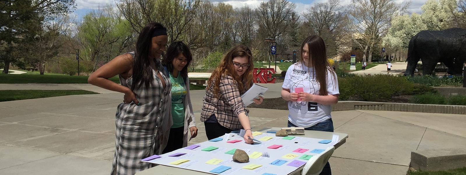 Students setting up outdoor booth