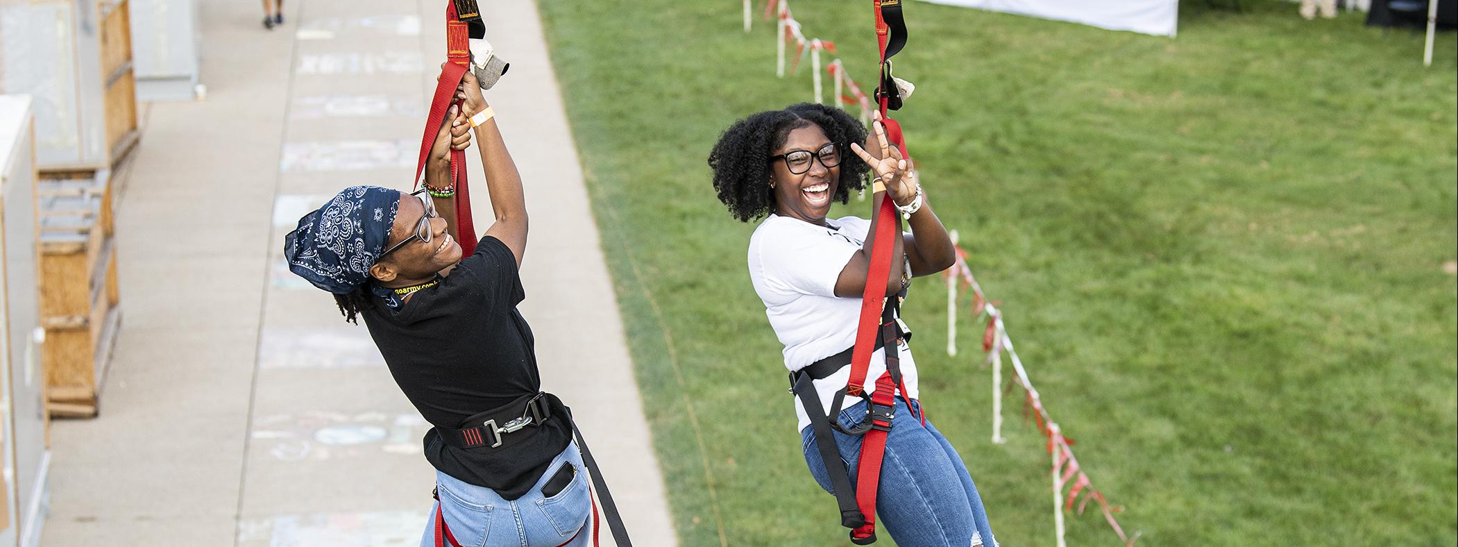 And the race is on for two PFW students ziplining at the annual Picnic on the Lawn on Sept. 7