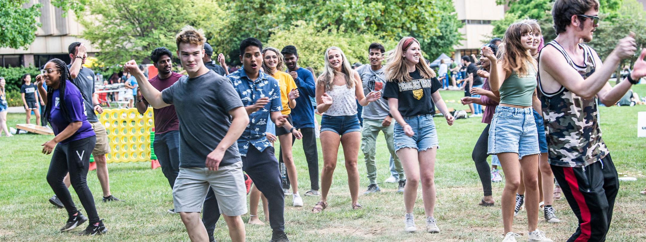 Freshman students at at a campus barbeque lunch