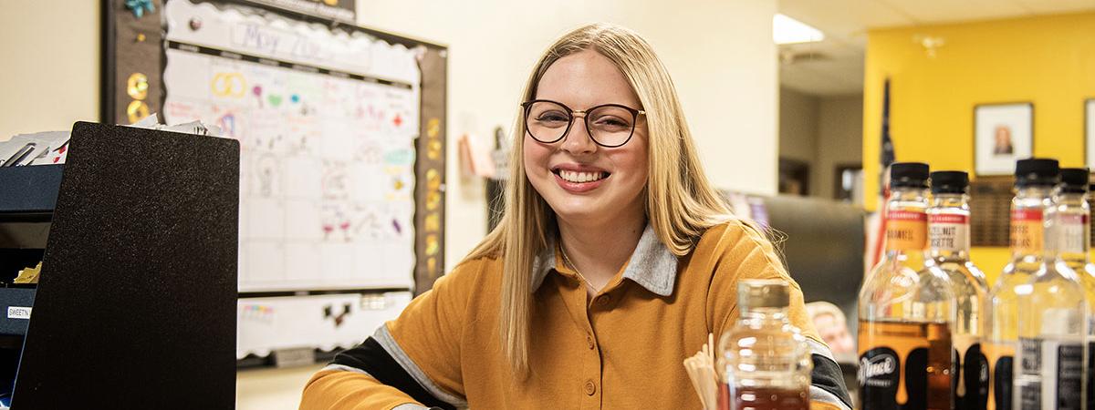 Mikayla Haggarty behind the desk in the Student Government office.