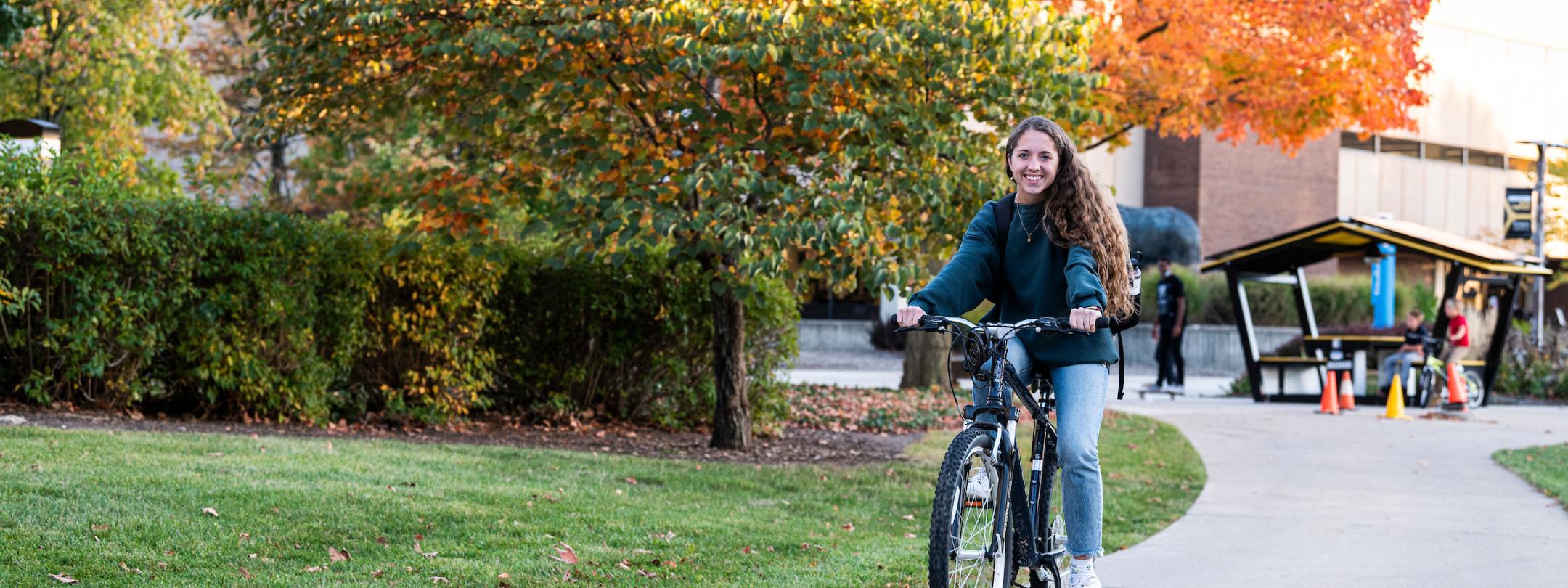 Student riding bike