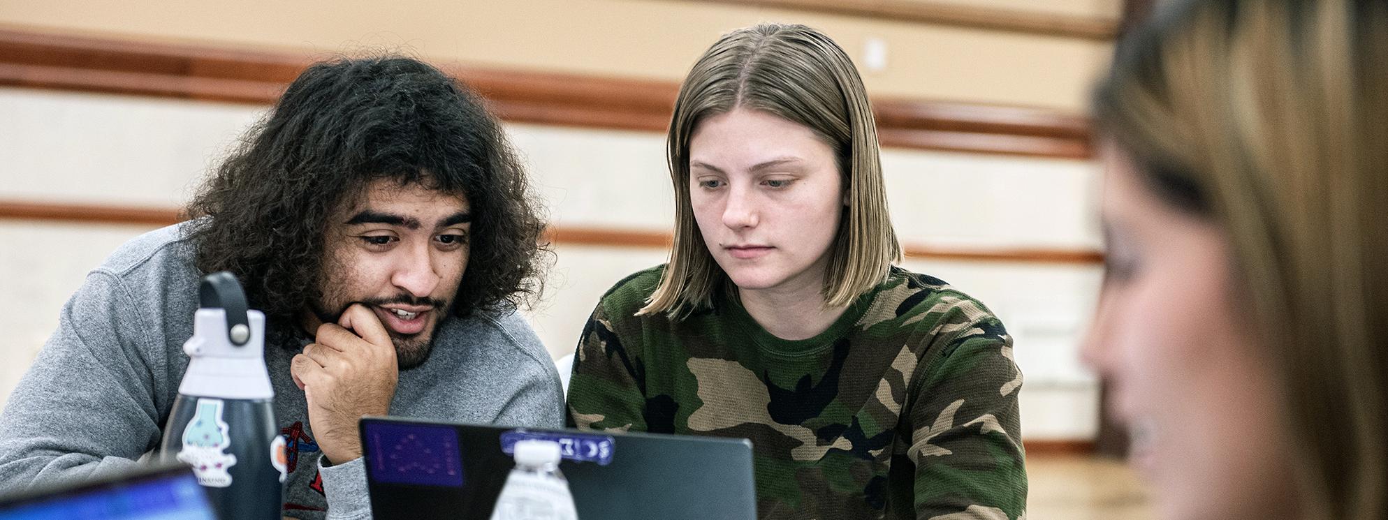 Students work together on an assignment in an organizational leadership class.