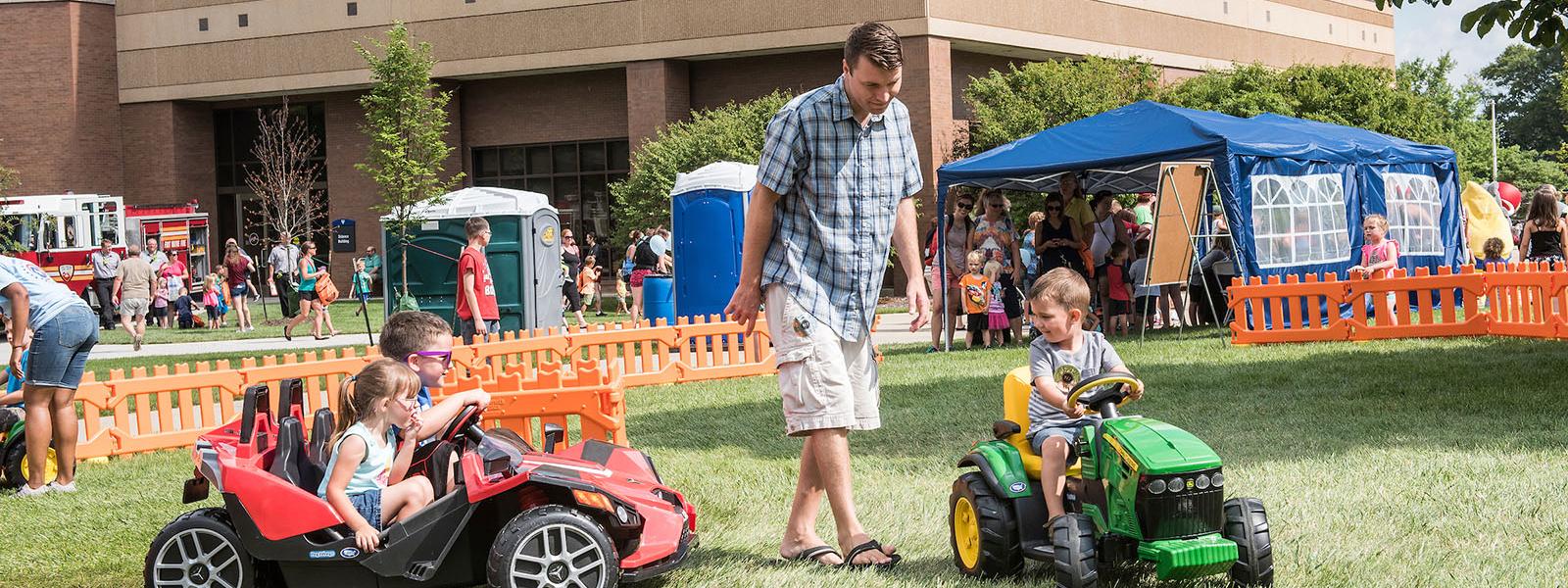 A father and his kids at children's fest