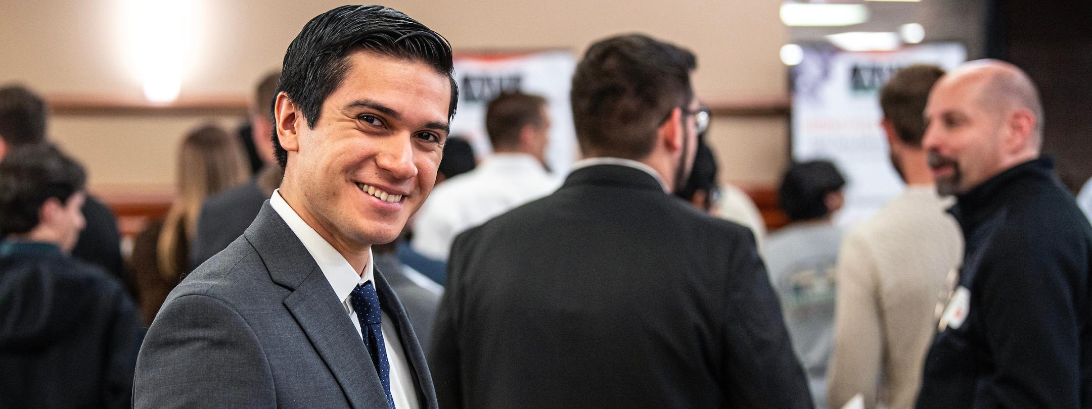 Student attends a networking opportunity on campus.