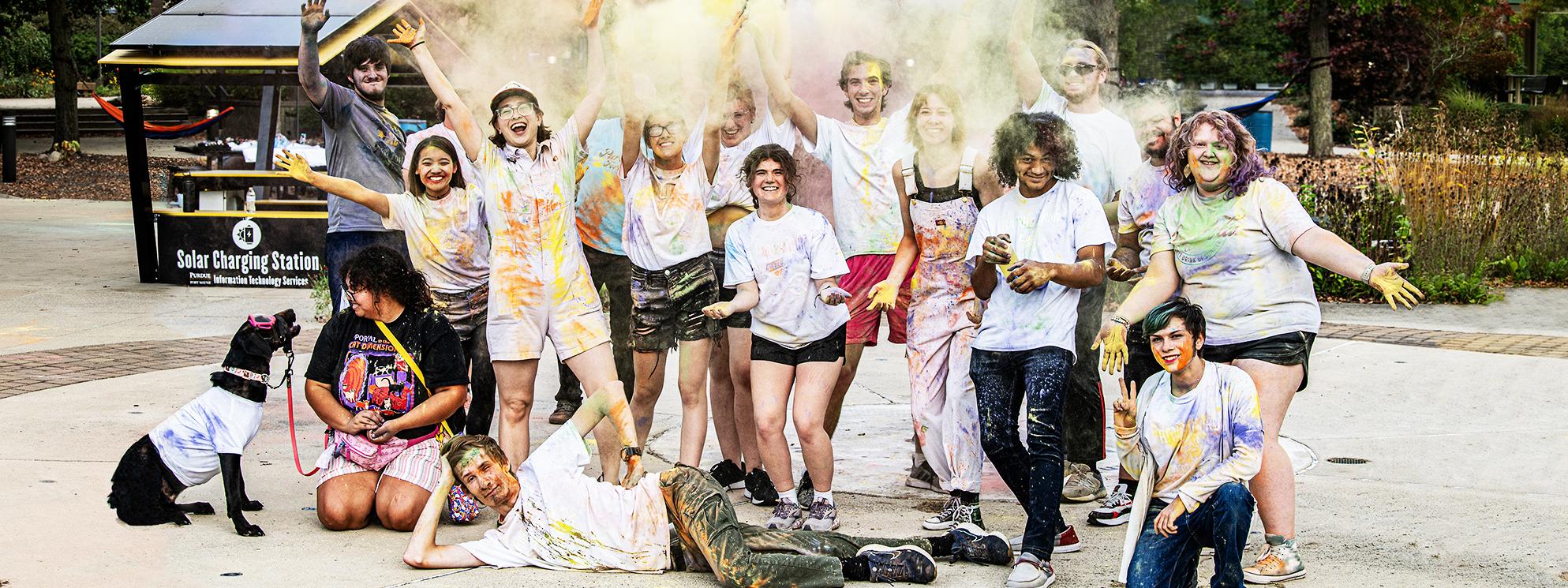 Students pose together after a rainbow run on campus.