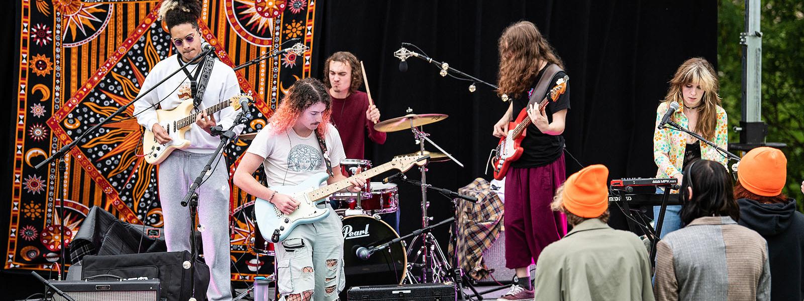 A band is performing onstage
