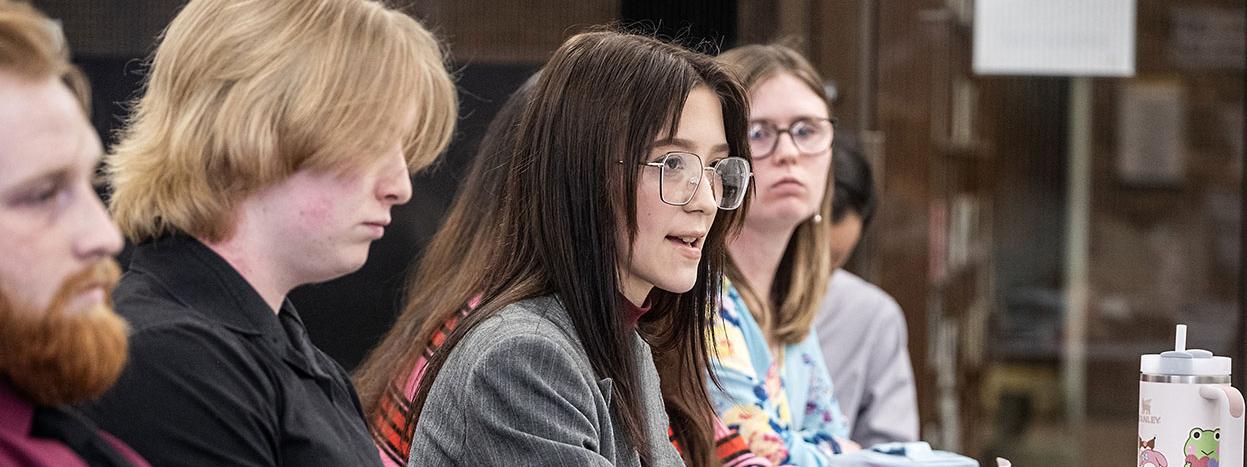 A student is questioning a witness at a mock trial