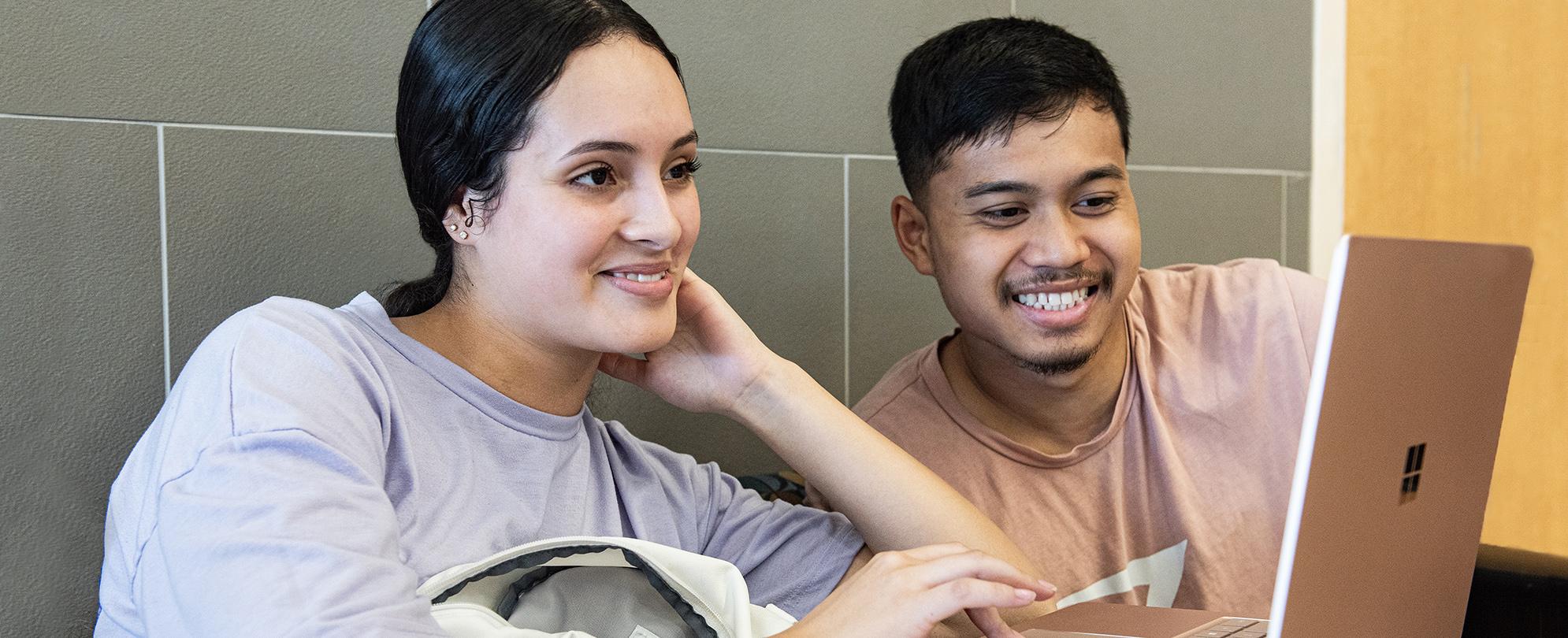 Two PFW students browse the Program Finder on the university website.