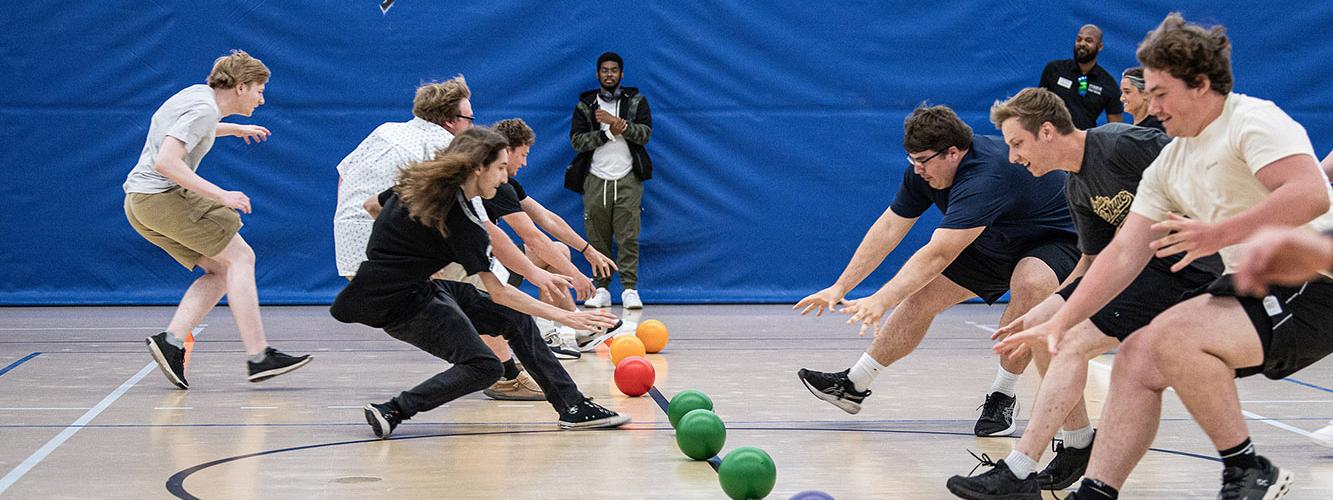 Students are lined up to start a game of dodgeball