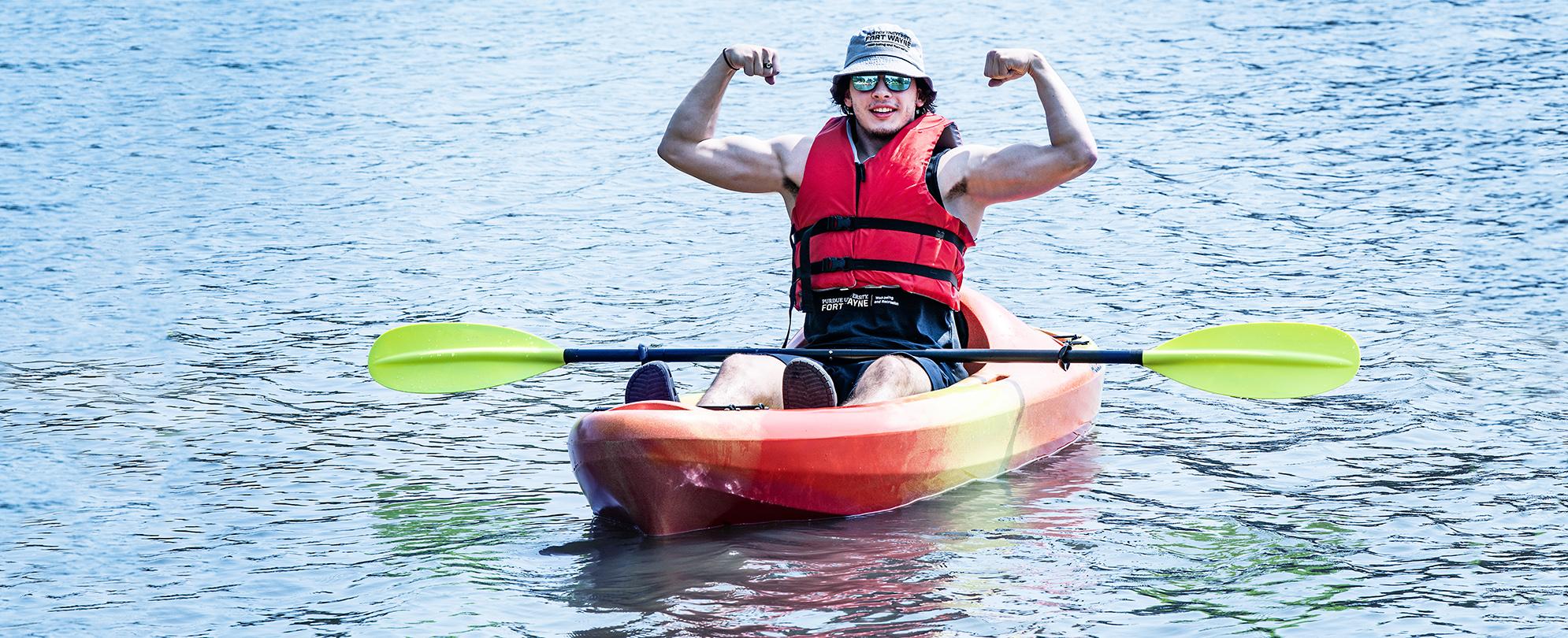 PFW student on the river using a Campus Rec kayak.