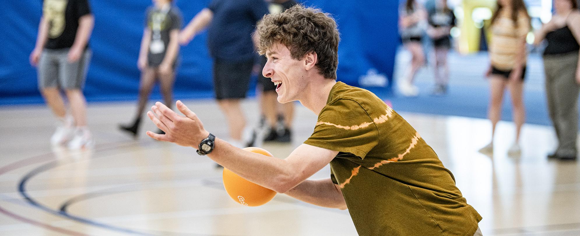 Students playing dodgeball during orientation.