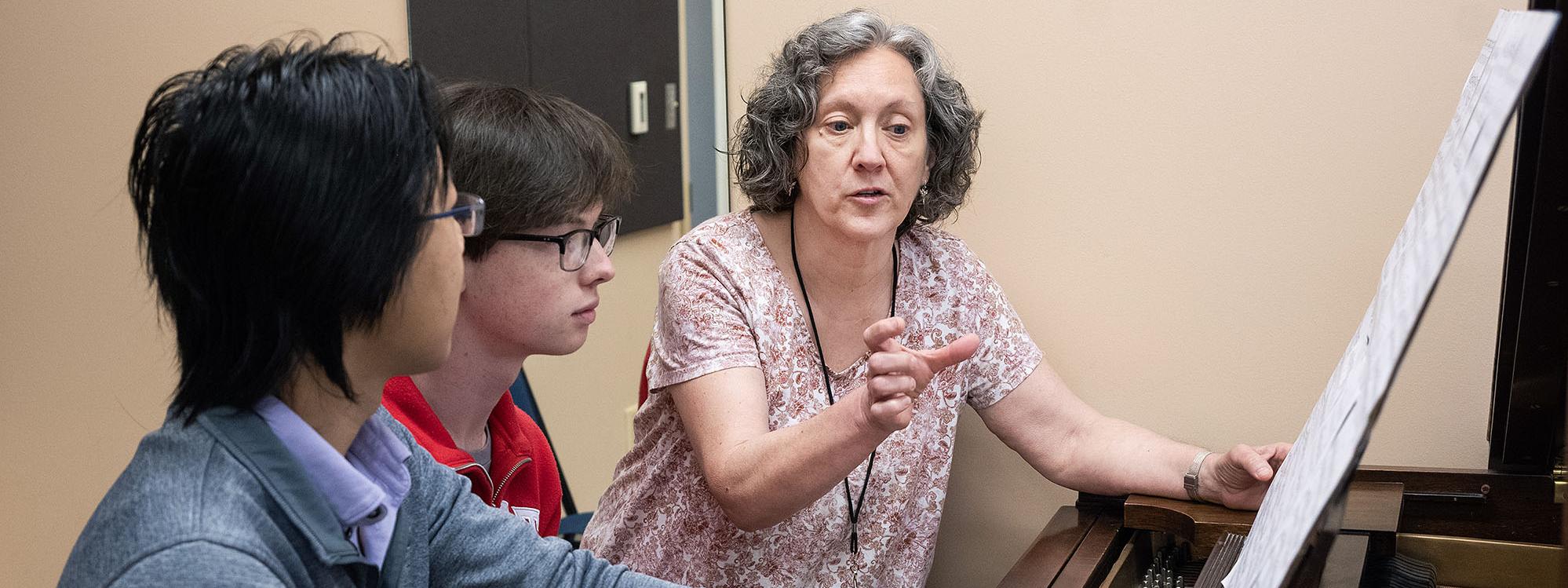 Susan Dorion is working with music students