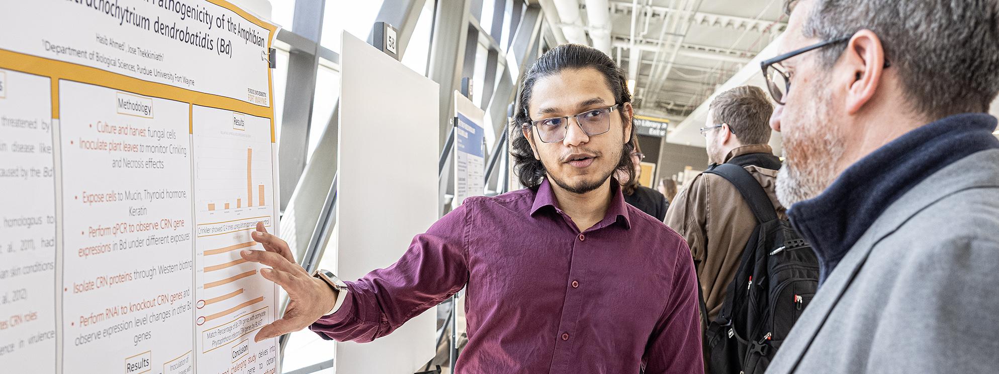 PFW student presents findings at the Student Research Symposium.