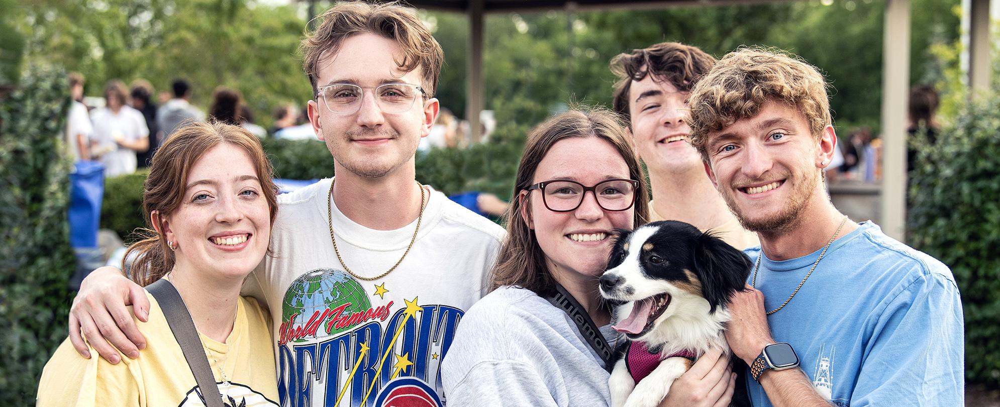 Students pose for a photo at a campus kickoff event.