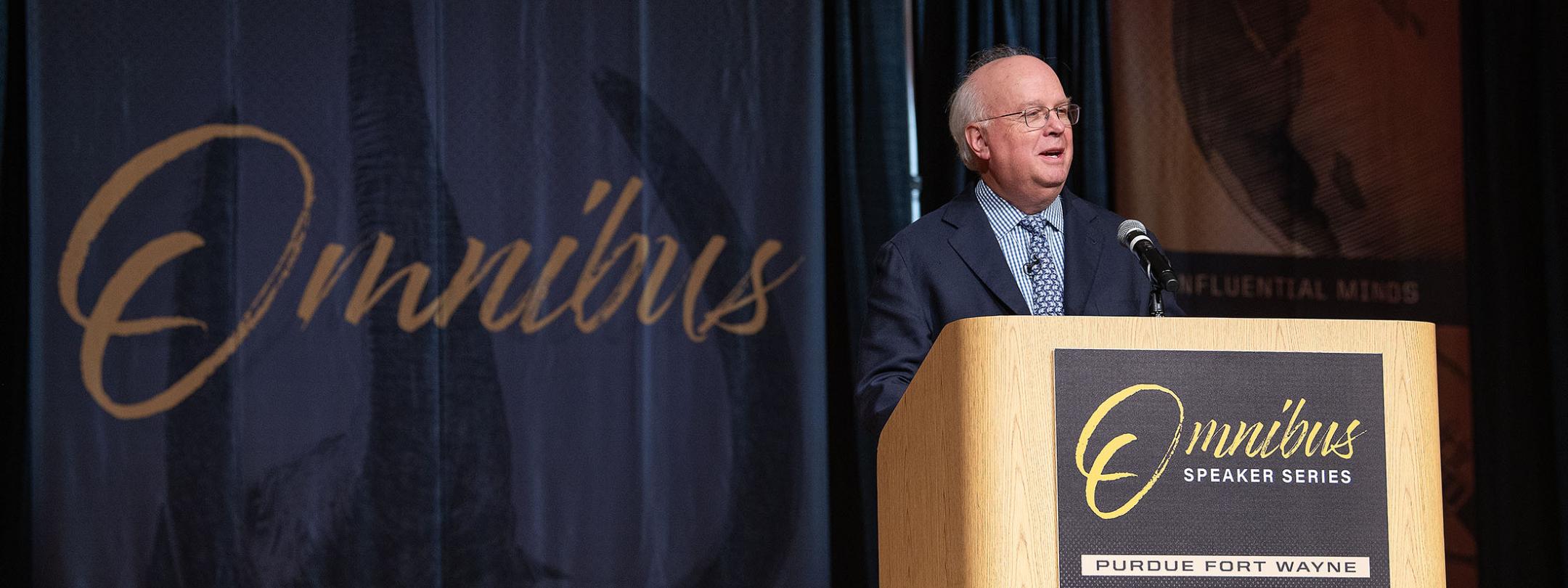 Karl Rove is speaking to the audience in Auer Performance Hall