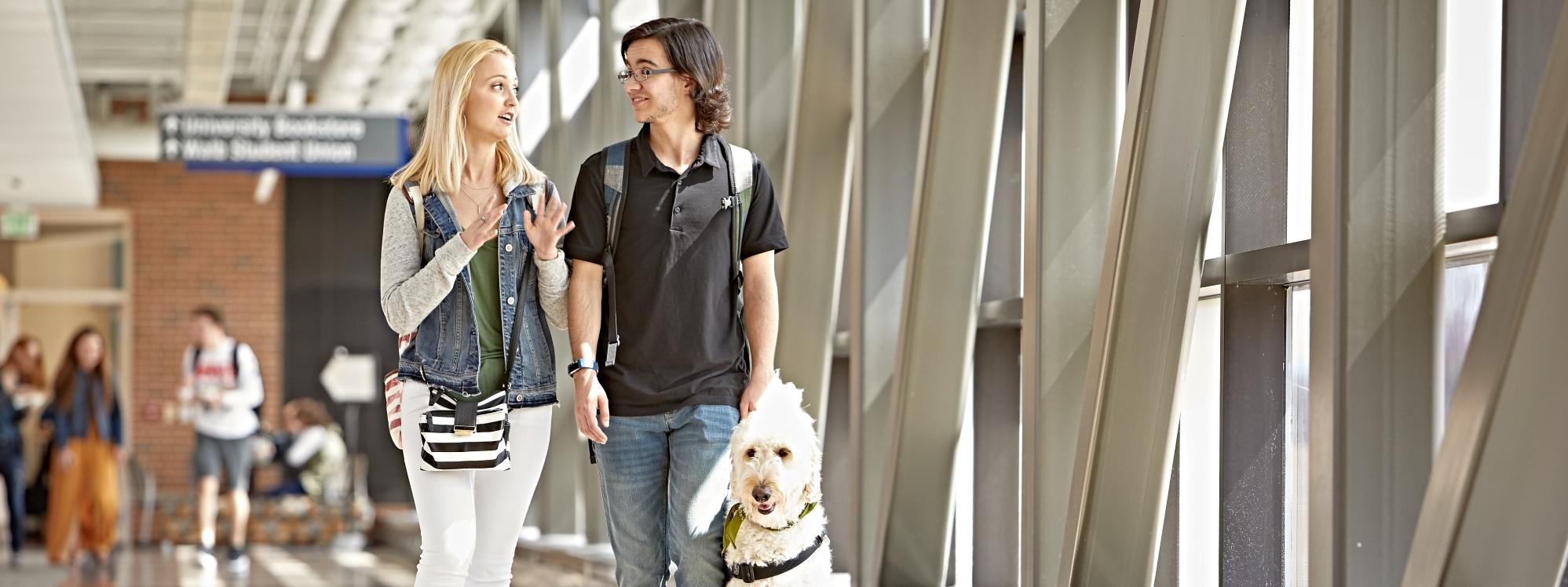 Students walking with service animal