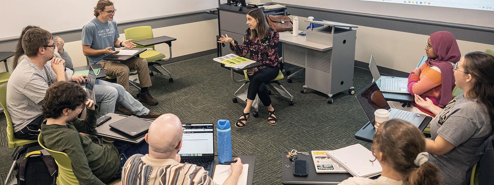 Students are sitting in a circle