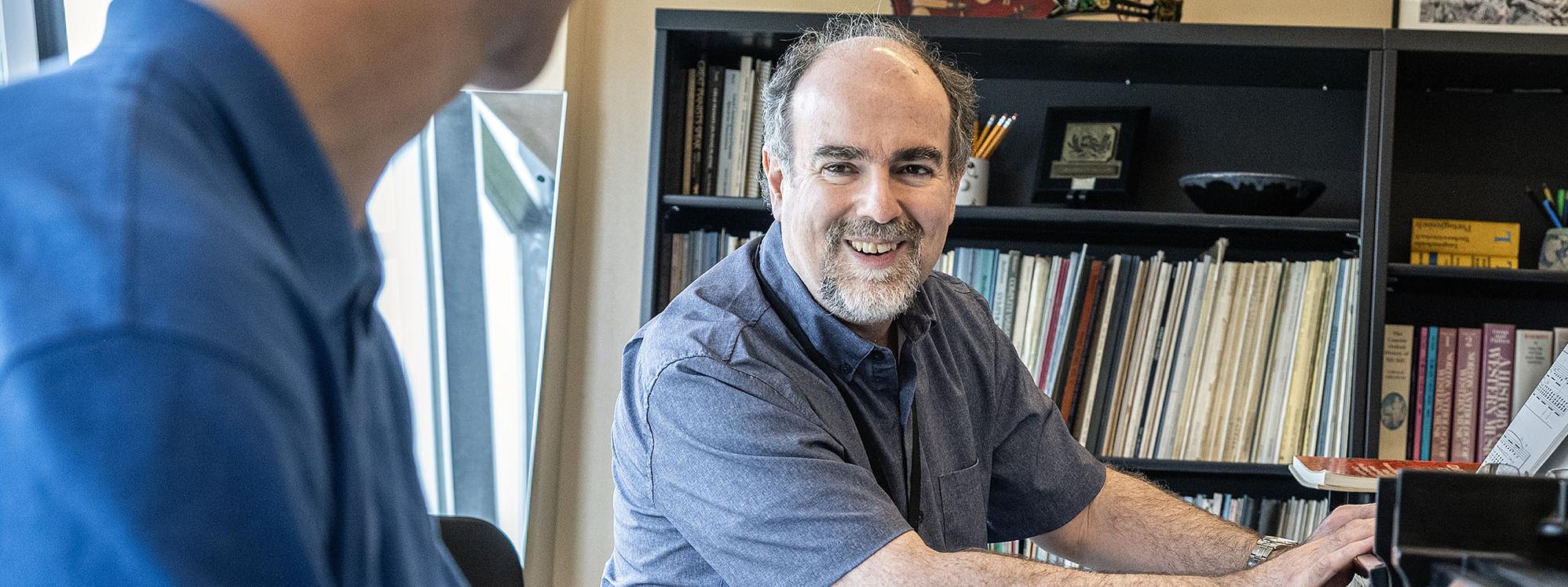 Hamilton Tescarollo is working with a piano student