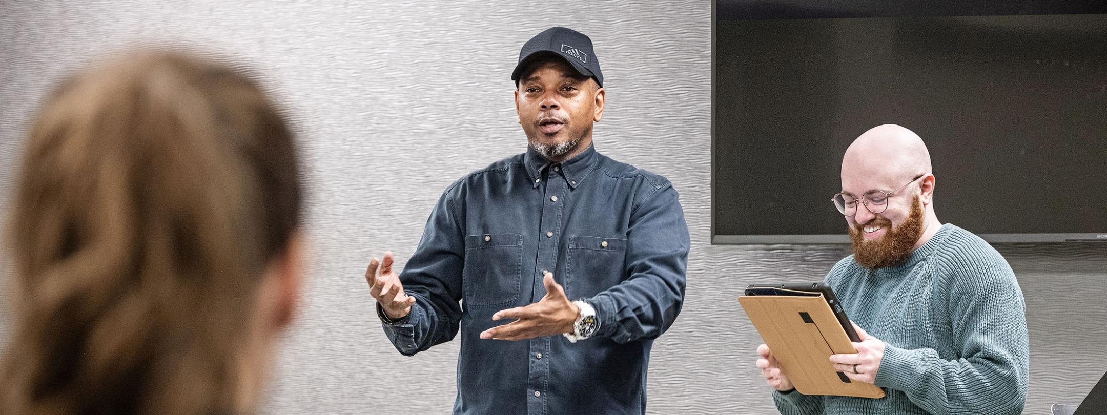 Curtis Crisler is speaking to students in a classroom