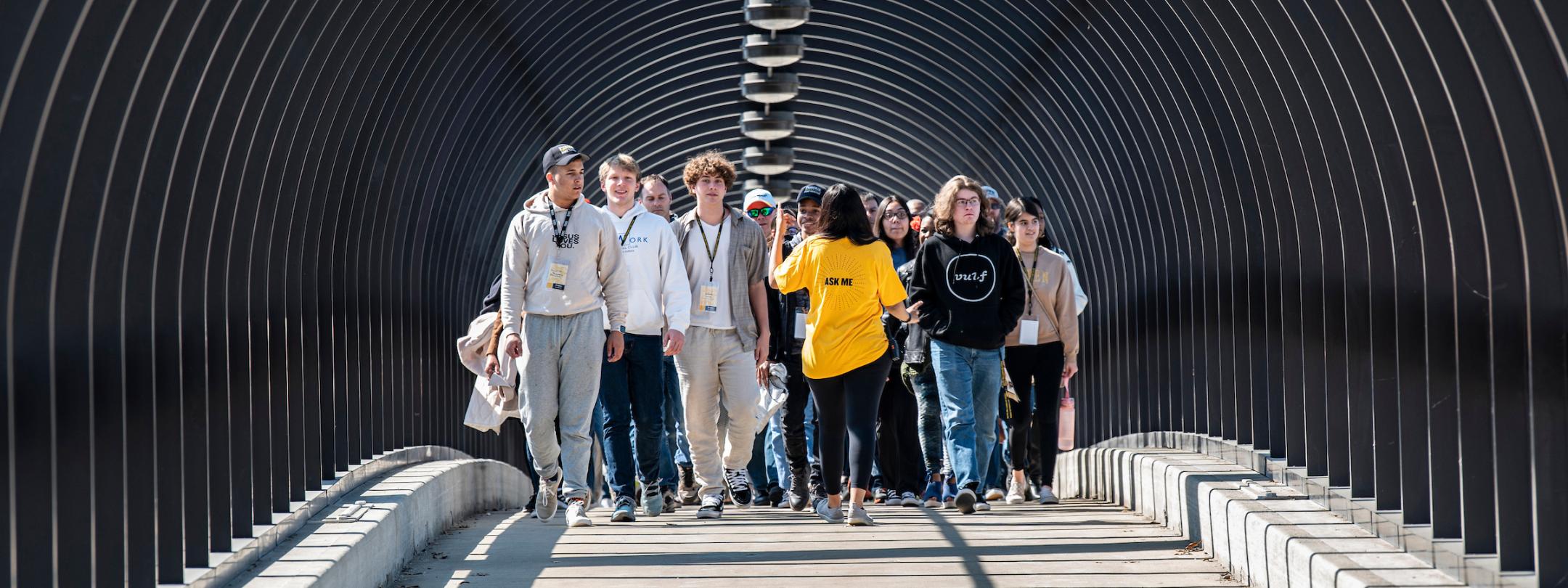 A tour guide giving a tour of campus.