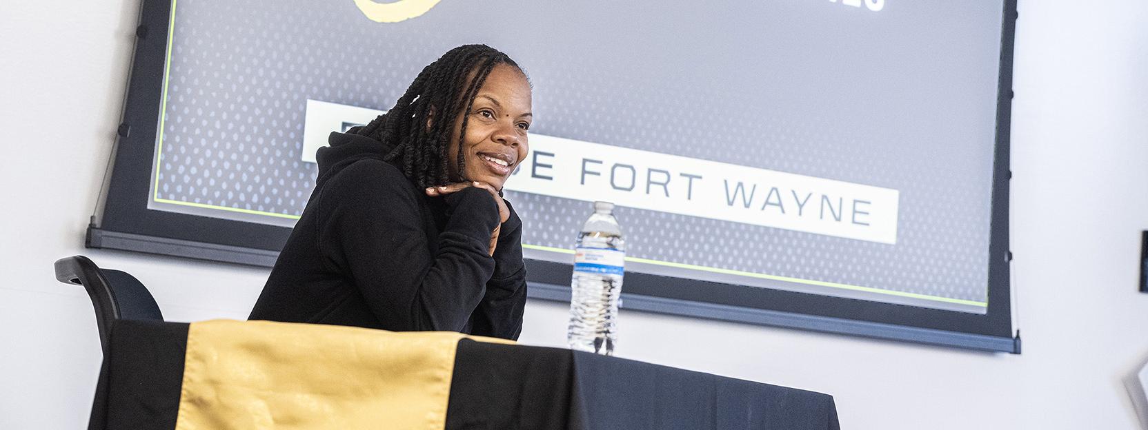 Melissa Proctor is speaking to students in a classroom