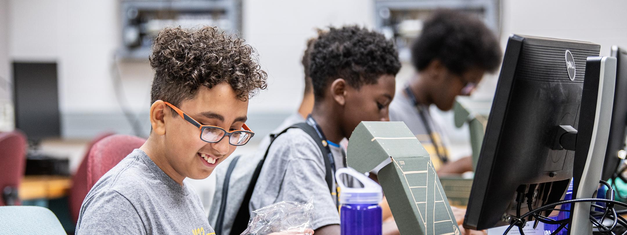 Young students working at computers