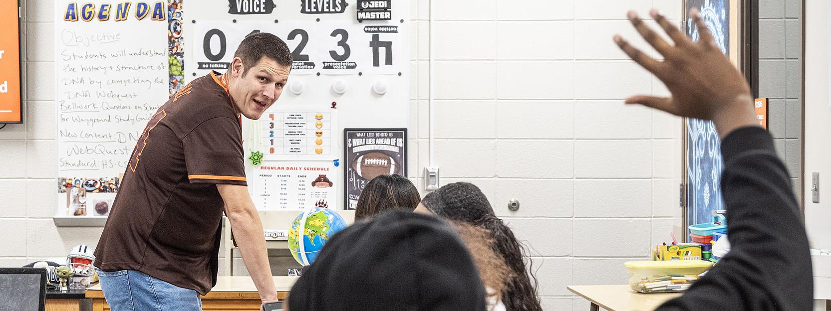 Jared McMullen is looking a a student who is raising their hand