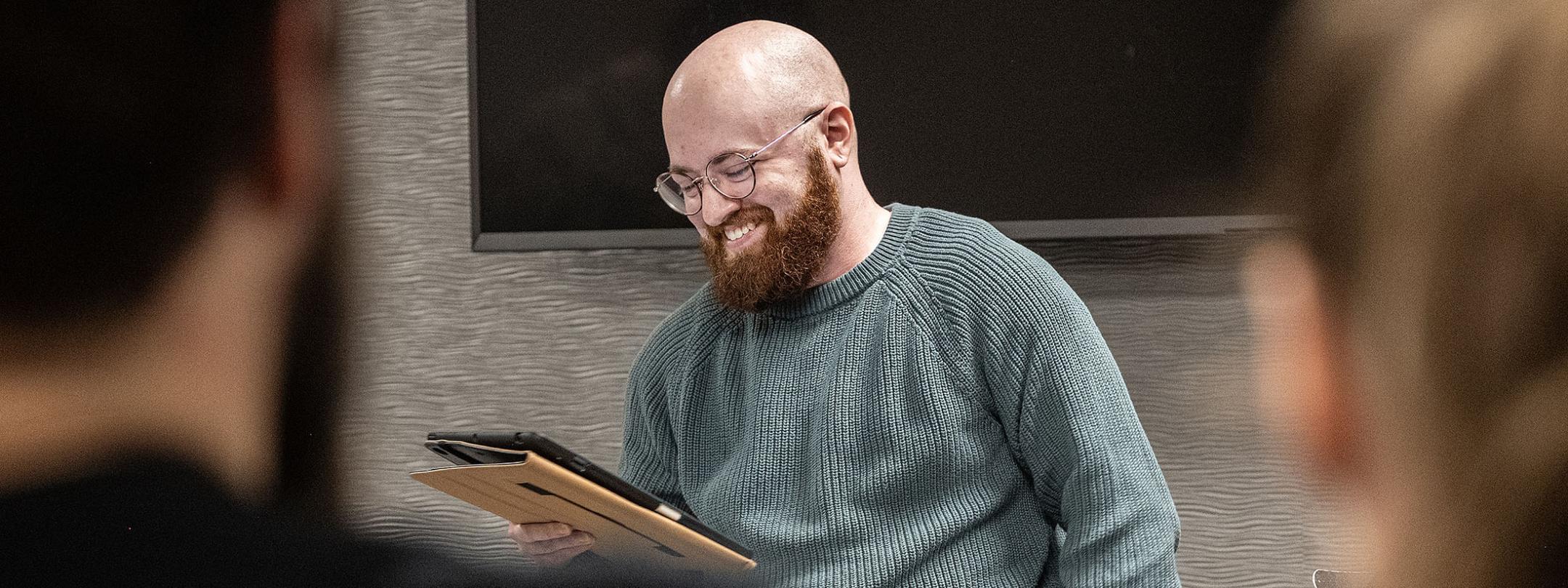 Eden Bailey is reading a poem in a classroom