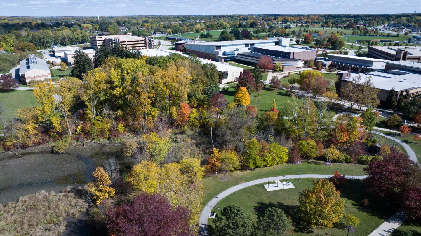 AERIAL PHOTO OF CAMPUS TREES IN FALL