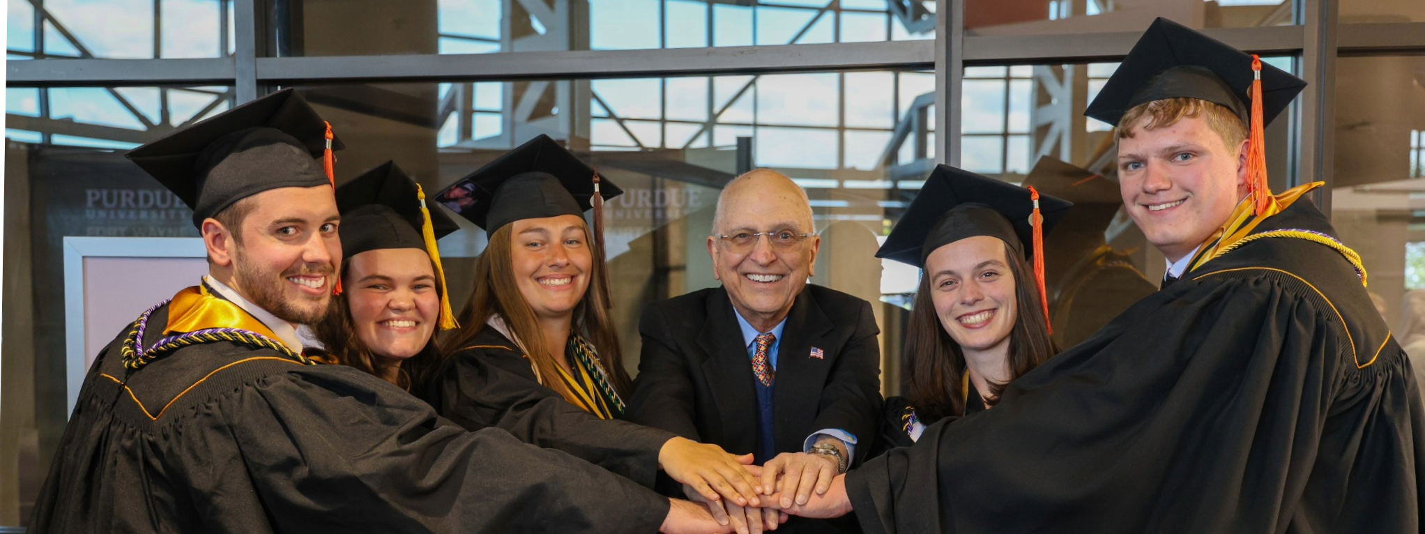 Graduating scholars with their donor.