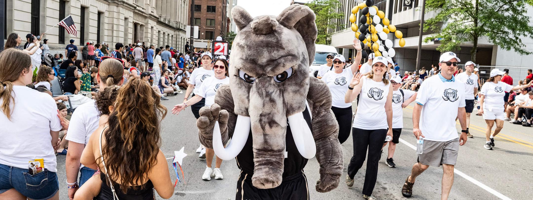 Don the mastodon is in front of PFW's parade unit