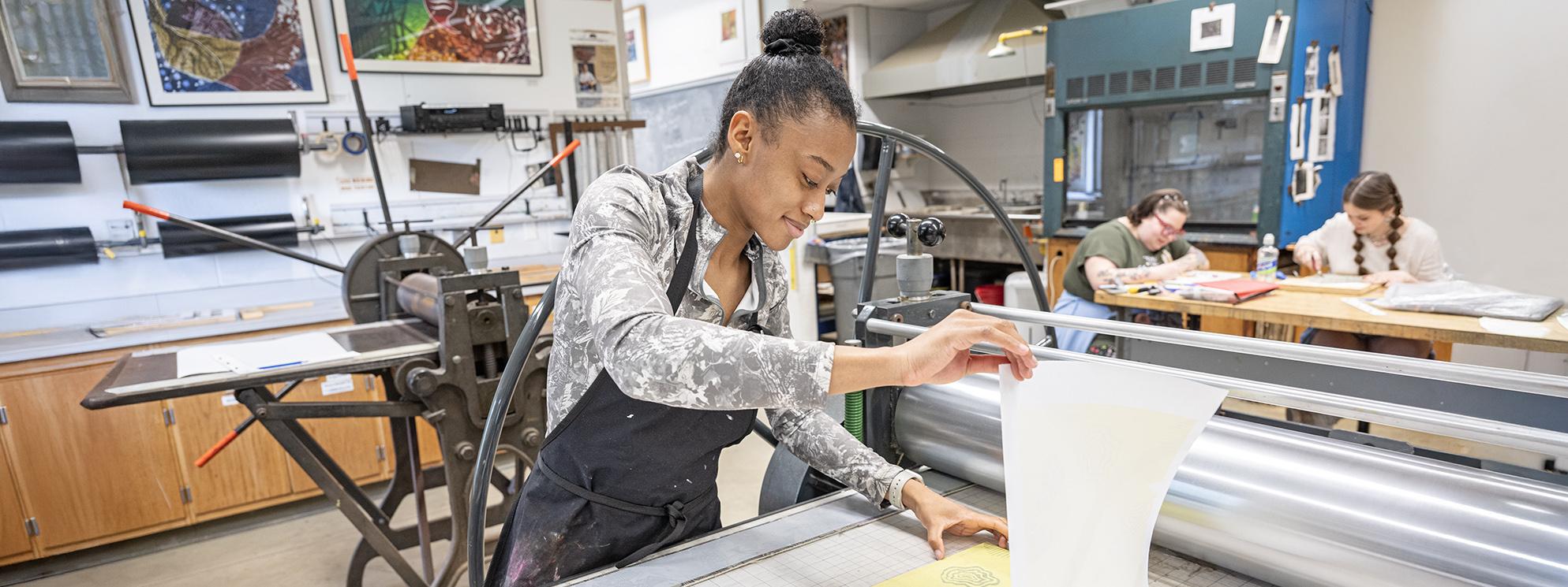 A student works in the printmaking lab