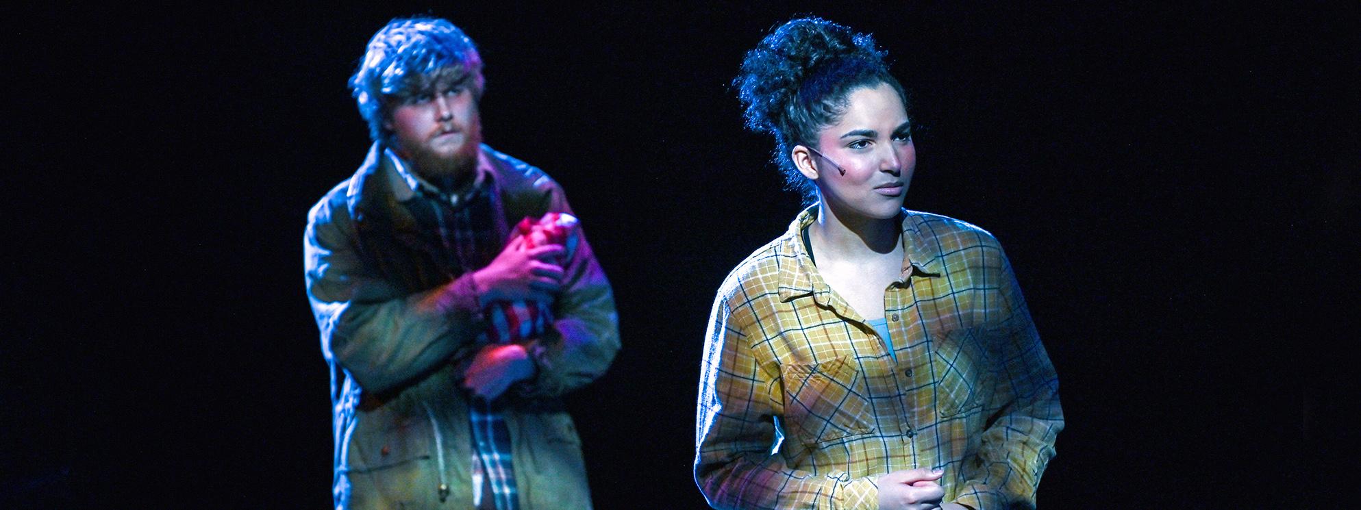 Two students perform in a theatre performance