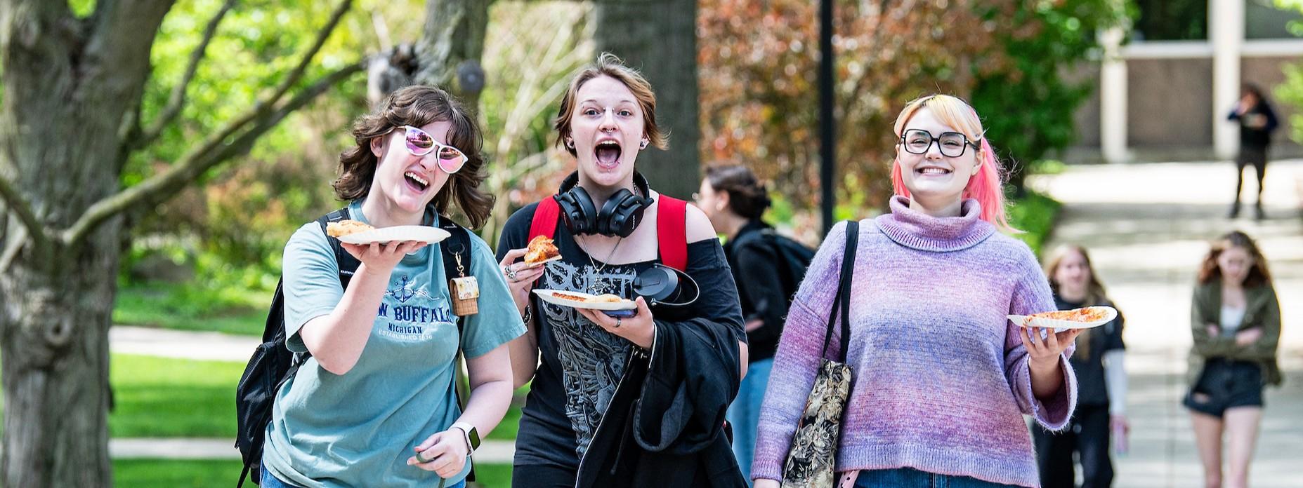3 students having fun on campus