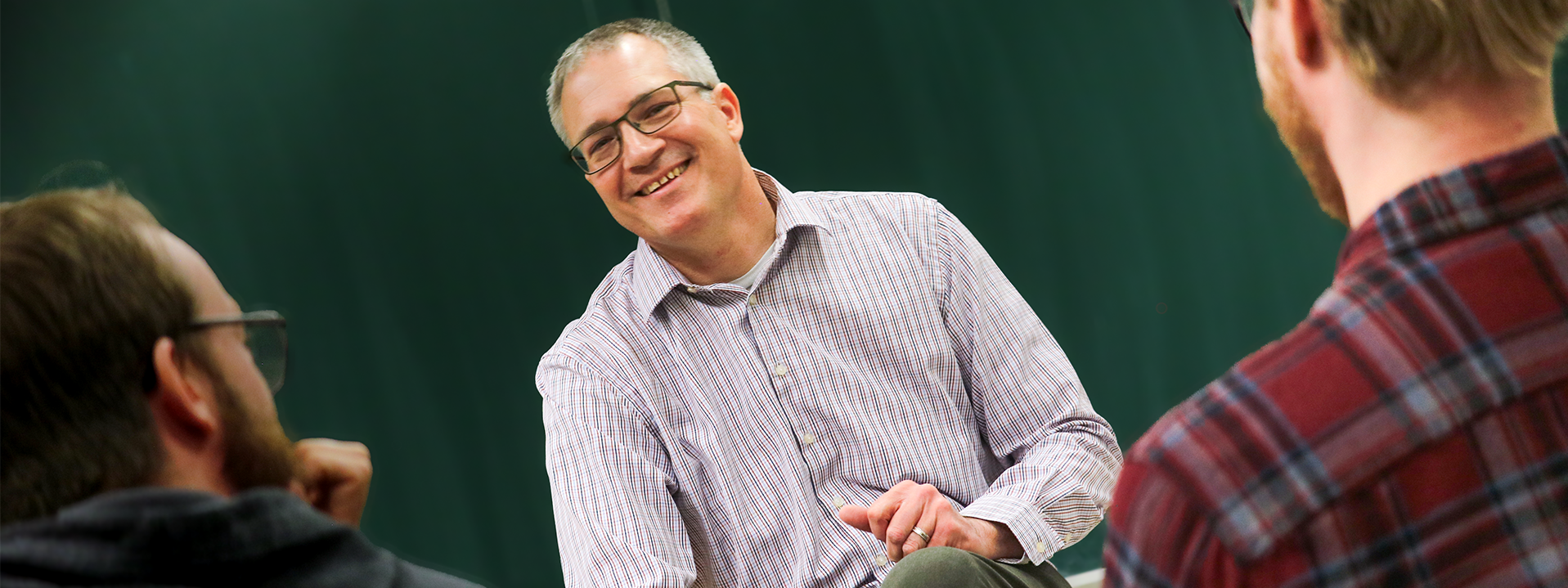 Dr. Roberts has a laugh with his class