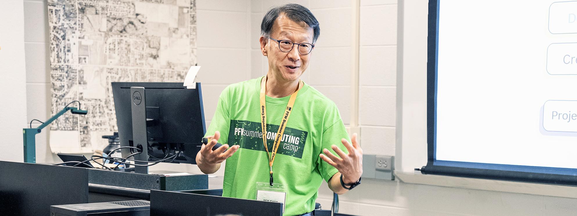 An instructor addresses a summer computing class