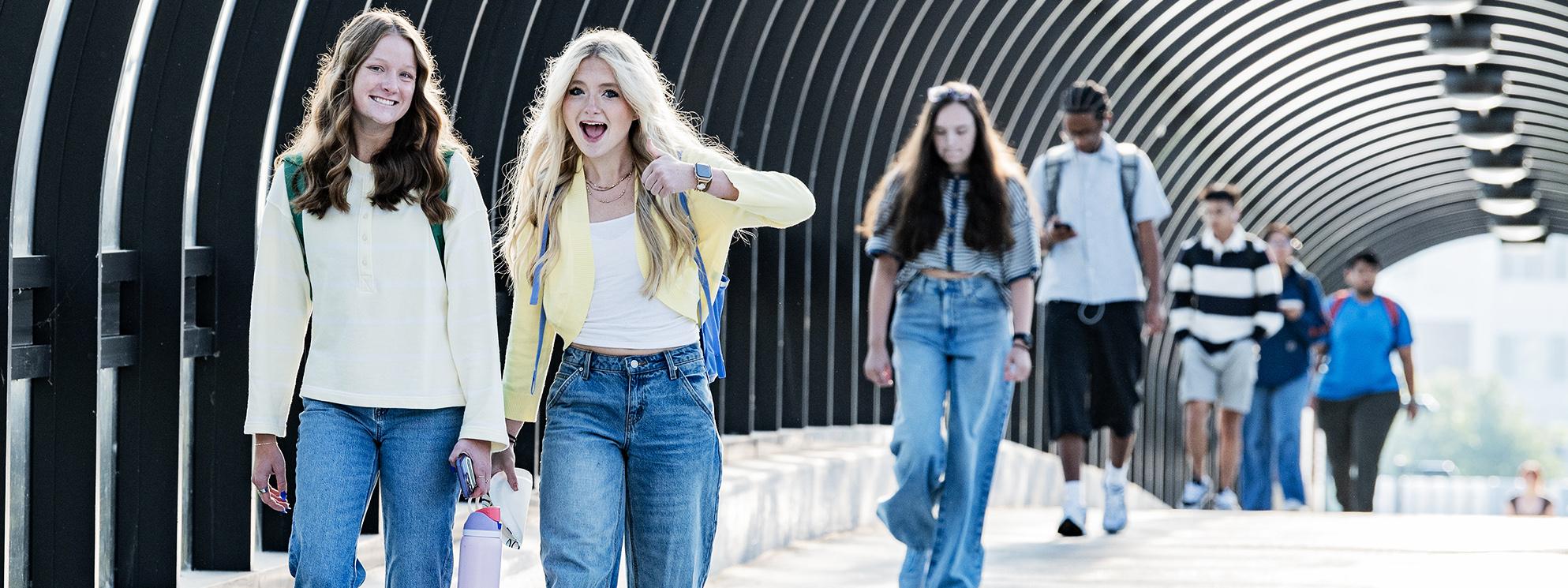 Students walking on bridge