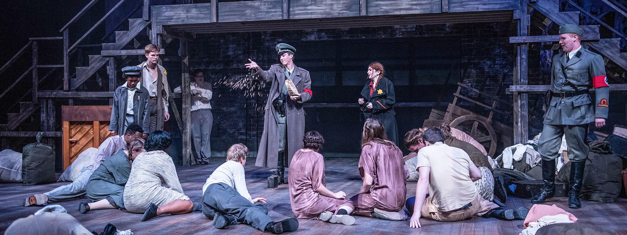 Theatre students performing on stage.