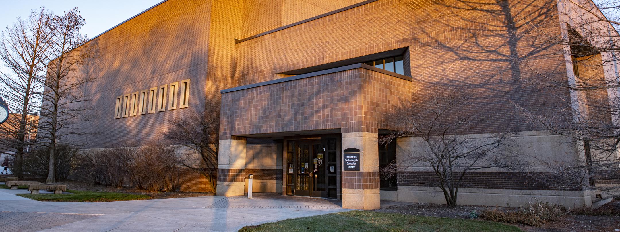 Entrance to the Engineering, Technology, and Computer Science building on an autumn day.