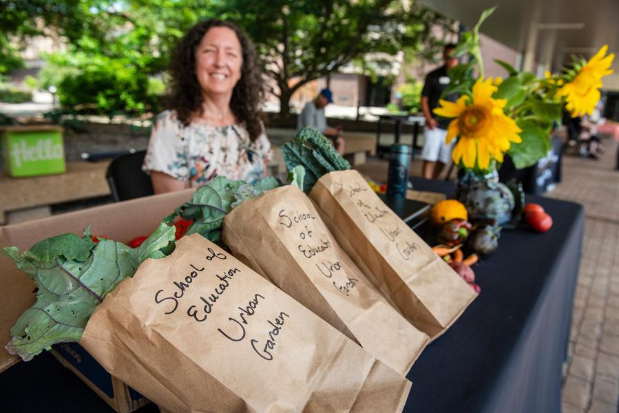 Produce vendor at the Mastodon Market.
