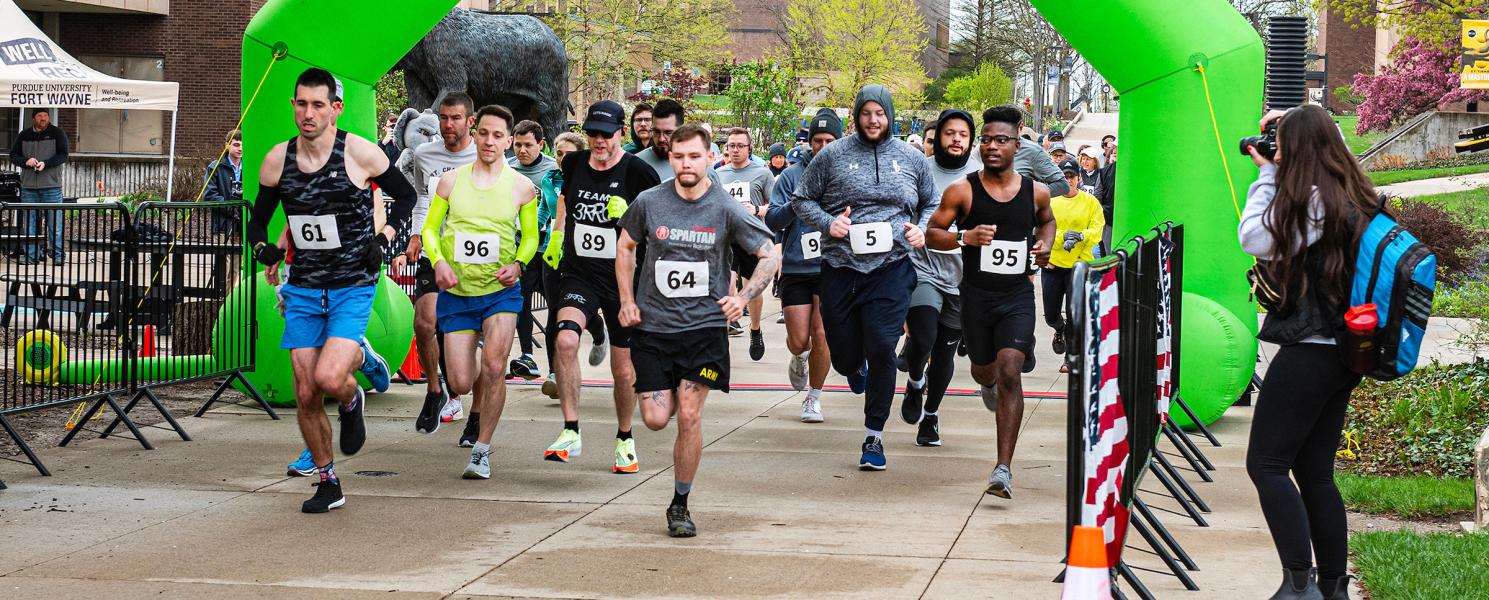 Community members and PFW employees participate in a 5K.