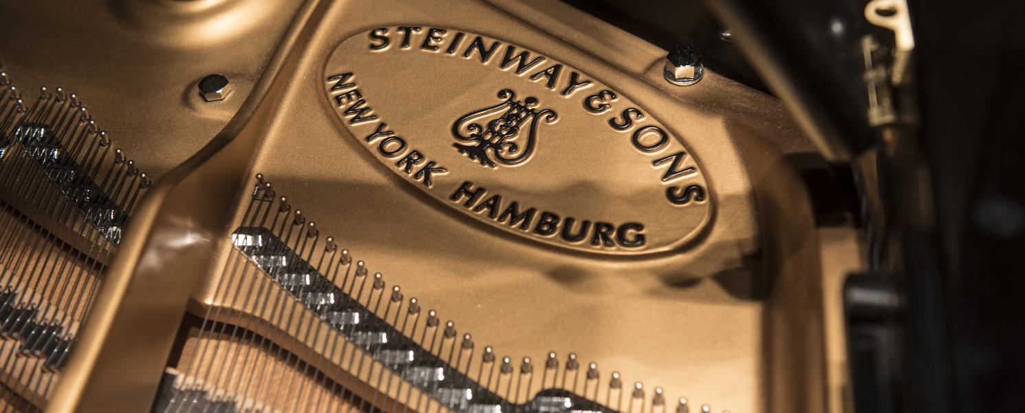 Close up photo of a piano.